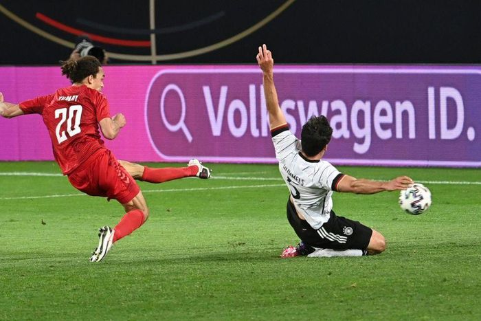 Denmark forward Yussuf Poulsen (L) scores the equaliser against Germany
