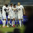 Minnesota United players celebrate with Kevin Molino (7) after a goal during the first half of the MLS playoff game against Sporting Kansas City