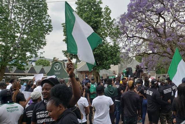 Nigerians living in South Africa protest in solidarity with youths back home protesting misgovernance and police brutality on Wednesday, Oct. 21, 2020 in Praetoria.  [Twitter/@NewsWireNGR]