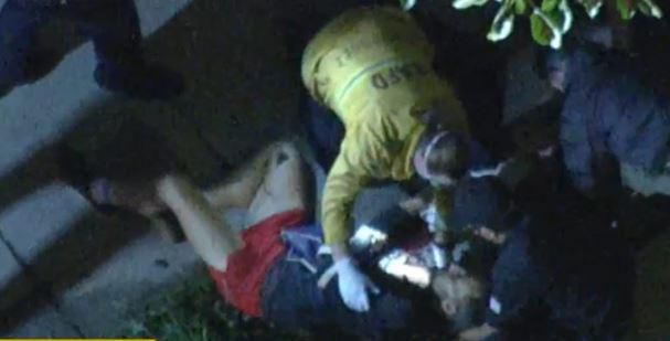 The dog walker, Ryan Fischer being attended to by medics after the shooting [PageSix]
