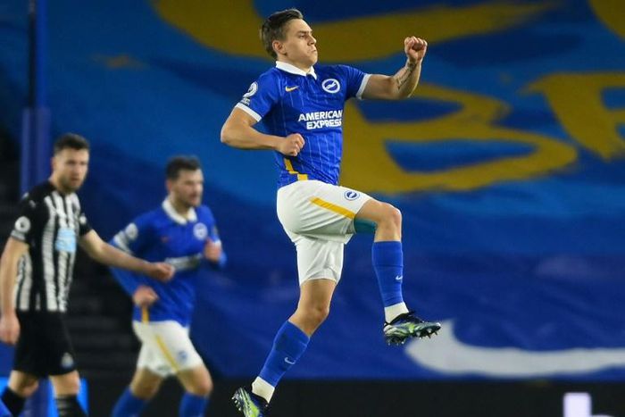 Jumping clear: Leandro Trossard (right) grabbed a goal and assist as Brighton moved six points clear of the relegation zone