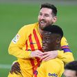 Ilaix Moriba (R) celebrates with Lionel Messi after scoring Barcelona's second goal against Osasuna on Saturday