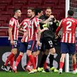 Atletico Madrid players congratulate goalkeeper Jan Oblak after his crucial late penalty save against Alaves