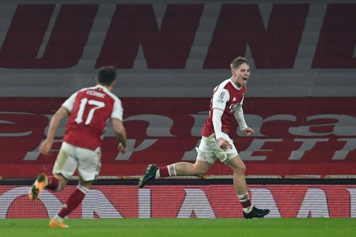 Arsenal midfielder Emile Smith-Rowe (R) celebrates scoring against Newcastle