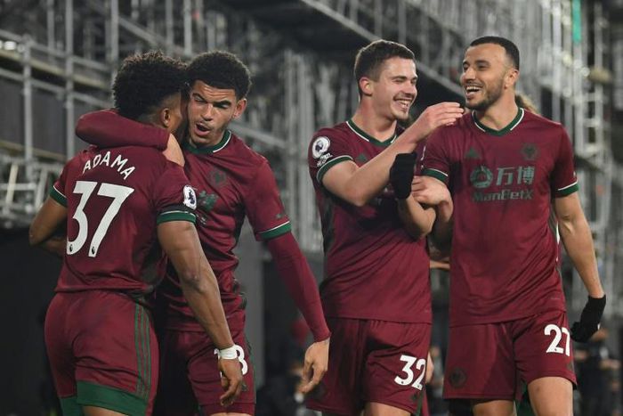 Late finish: Wolverhampton Wanderers' Adama Traore celebrates with teammates