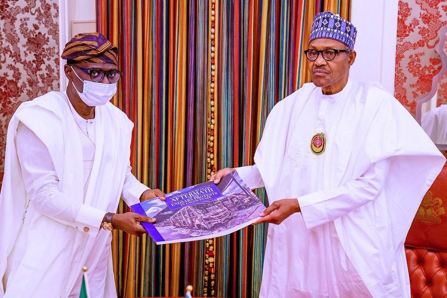 Governor Babajide Sanwo-Olu shows President Muhammadu Buhari a photo album of destruction recorded in Lagos during #EndSARS protests in October 2020. (Presidency)