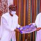 Governor Babajide Sanwo-Olu shows President Muhammadu Buhari a photo album of destruction recorded in Lagos during #EndSARS protests in October 2020. (Presidency)