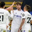 Leeds forward Patrick Bamford (2R) celebrates scoring at Leicester