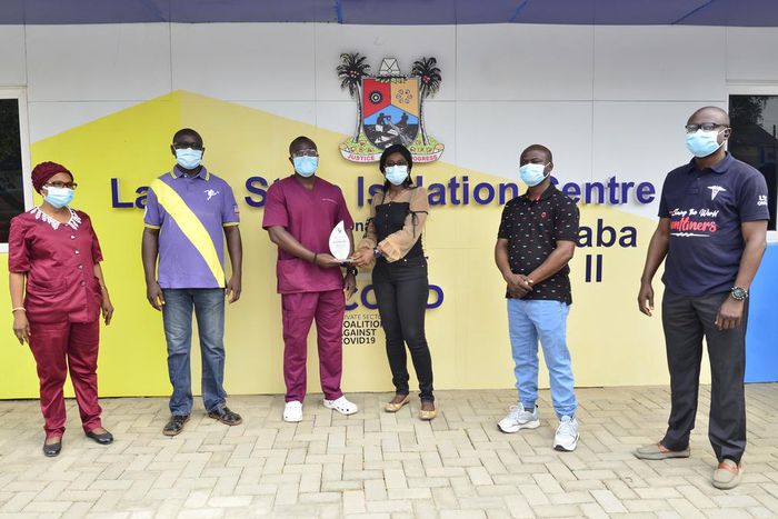 (L-R) Adeoye Basirat, Head of Nursing Department, Mainland Hospital; Dr. Bowale Abimbola, MD Mainland Hospital, Yaba; Dr. Ayodeji Anthony Falana receiving an award as most outstanding health worker in the fight against COVID-19; Chineze Amanfo, Corpora...