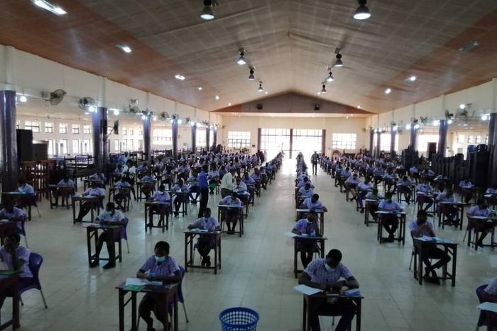 Student writing WASSCE WAEC
