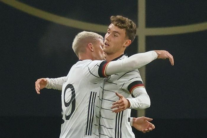 Luca Waldschmidt (R) celebrates scoring Germany's winning goal in Leipzig