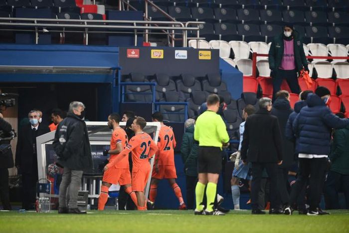 Istanbul Basaksehir players walk off the pitch at the Parc des Princes as their Champions League game with PSG was suspended over allegations of racism by one of the match officials