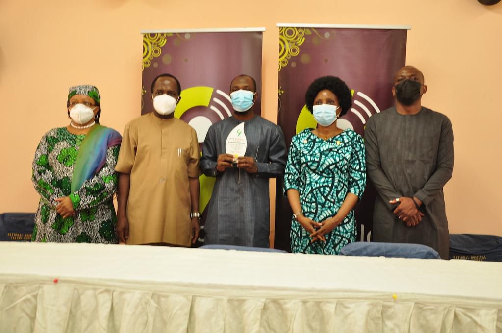 L-R: Chairman Medical Advisory Committee, National Hospital, Dr. Aisha Umar; Chief Medical Director, National Hospital Abuja, Dr.Jafaru Momoh; Award recipient, Dr. Abdussamad Ayinde; Representative of the Hon. Min. of Health, Dr. Osagie Ehanire and Dir...