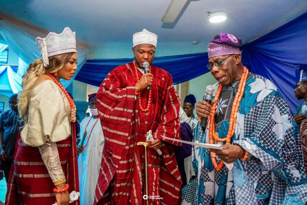 Chief Olusegun Obasanjo presenting the staff and certificates to newly installed chiefs.
