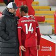 Liverpool captain Jordan Henderson leaves the pitch after suffering an injury during the Premier League match against Everton