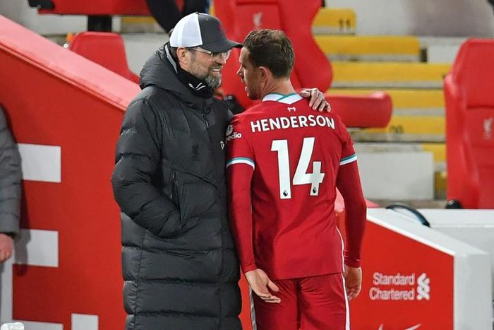 Liverpool captain Jordan Henderson leaves the pitch after suffering an injury during the Premier League match against Everton