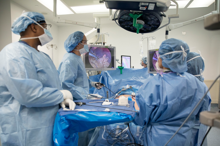 In this Monday, Dec. 16, 2019 photo, Dr. Neil Floch, second from left, performs gastric bypass surgery laparoscopically, using monitors to guide him at Nuvance Health's hospital in Norwalk, Conn. Obesity surgery is becoming a more common way to lose we...