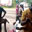 Sakawa boys fight Kasoa women for killing snake that crawled from their car to vomit money