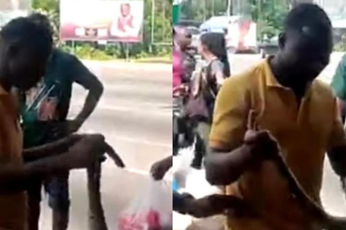 Sakawa boys fight Kasoa women for killing snake that crawled from their car to vomit money