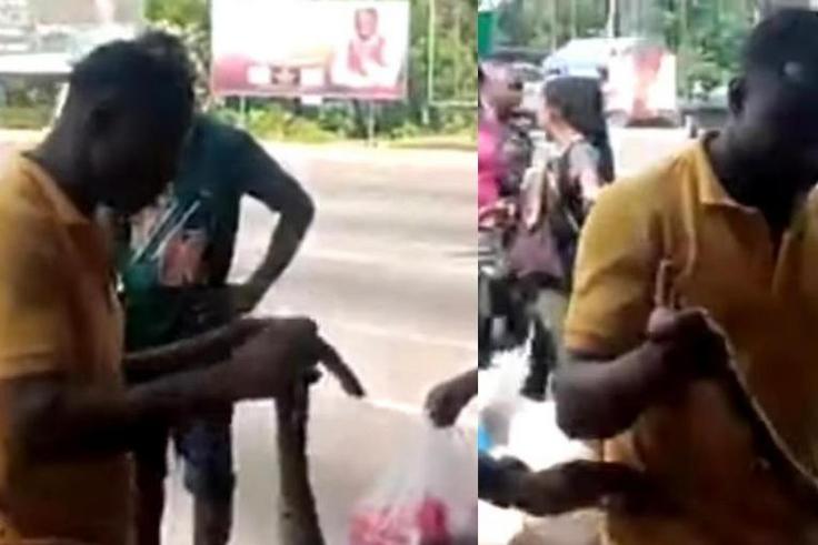 Sakawa boys fight Kasoa women for killing snake that crawled from their car to vomit money