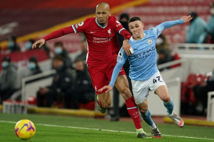 Manchester City midfielder Phil Foden (R) starred against Liverpool