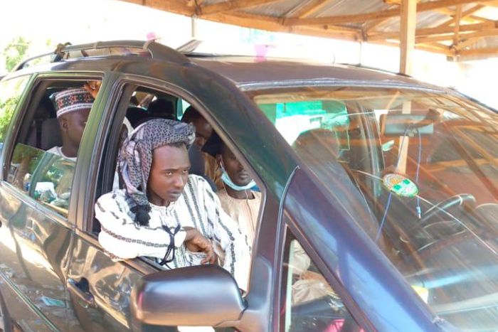 The suspect sitting by the door on the front seat (Daily Trust)