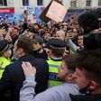 Chelsea's Petr Cech (3L) attempts to talk to supporters outside Stamford Bridge