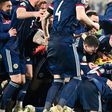 Scotland players celebrate qualifying for a major international tournament for the first time since 1998