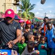Champion and family man, Kamaru Usman shares an unforgettable CSR experience, feeds 1000 children