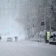 Snow stopping: People walk amid a heavy snowfall in Madrid