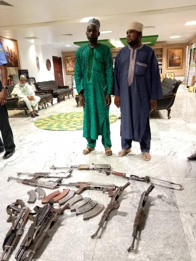 Sale Turwa and Muhammed Sani Maidaji surrendered almost a dozen AK-47 rifles to the Katsina State Government [The Nigerian News]