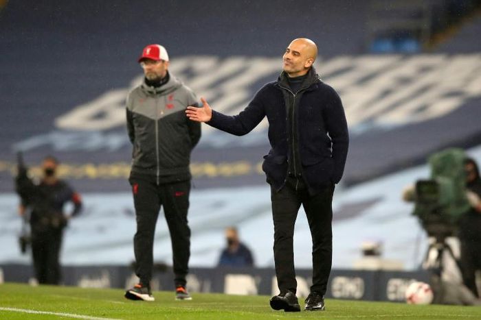 Manchester City boss Pep Guardiola (right) and Liverpool boss Jurgen Klopp shared the spoils in a 1-1 draw at the Etihad