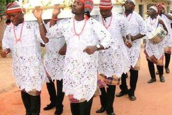 Handlers conveying a coffin {research gate]