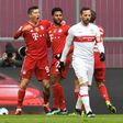 Robert Lewandowski (L) celebrates as Bayern Munich romp to a 4-0 home win over Stuttgart