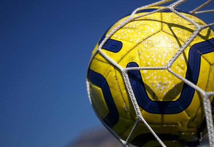 English Premier League ball in the back of the net [Joshua Hoehne/Unsplash]