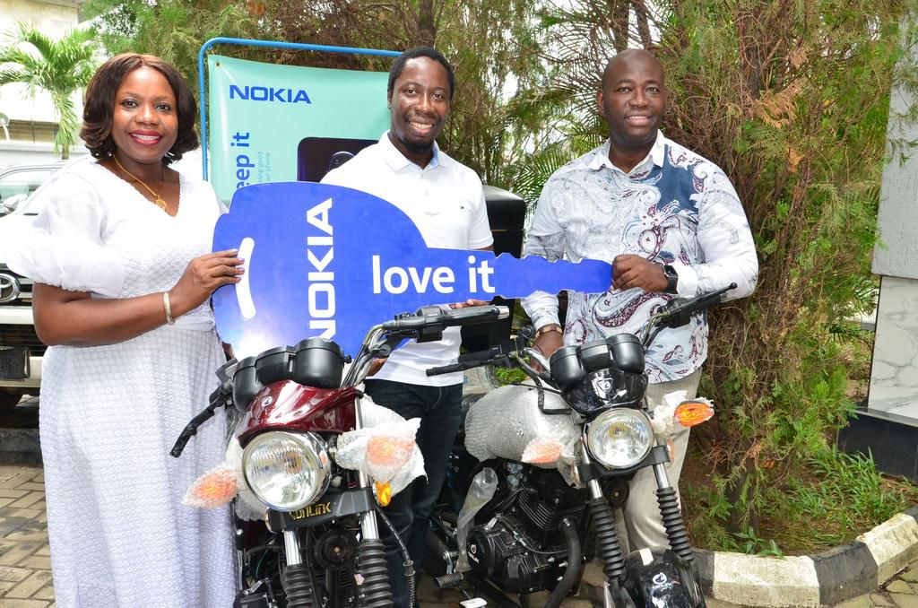 L-R: Coordinating Managing Director, TD Africa, Chimere Chioma; General Manager, Finet Communications, Nwosu Collins and Senior Business Manager(West Africa), HMD Mobile Nigeria Limited, Emmanuel Ossai during the presentation of trucks and delivery bik...