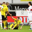 Erling Braut Haaland (2ndl) helps Dortmund captain Marco Reus (C) in the 3-2 win at Stuttgart on Saturday