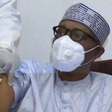 Buhari receiving COVID-19 vaccines