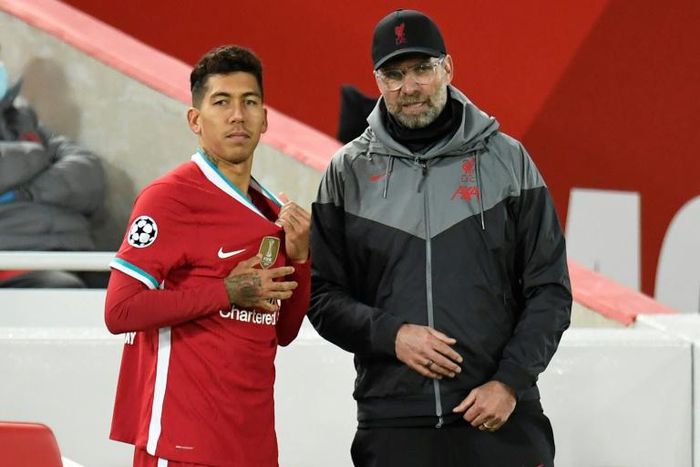 Jurgen Klopp (right) defended Roberto Firmino's (left) impact at Liverpool despite a shortage of goals from the Brazilian striker