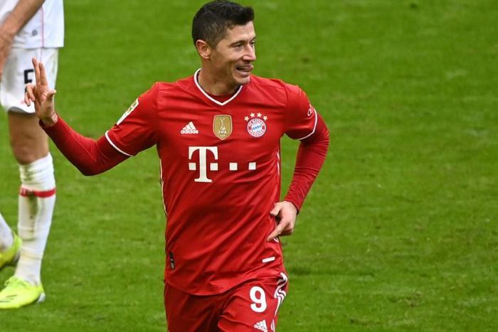 Robert Lewandowski celebrates his hat-trick on Saturday which leaves him five goals short of the Bundesliga record