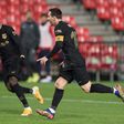 Lionel Messi celebrates with Ousmane Dembele after scoring one of his two goals in Barcelona's 4-0 win at Granada