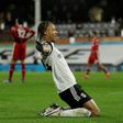 Bobby Decordova-Reid (centre) scored Fulham's goal in a 1-1 draw with Liverpool on Sunday