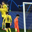 Erling Braut Haaland (L) celebrates scoring Borussia Dortmund's opening goal by lifting teammate Marco Reus off his feet