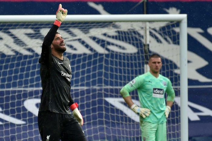 Liverpool goalkeeper Alisson Becker (left)dedicated his winning goal over West Brom to his late father