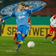 Holstein Kiel midfielder Alexander Muehling nets their first-half penalty at Kiel