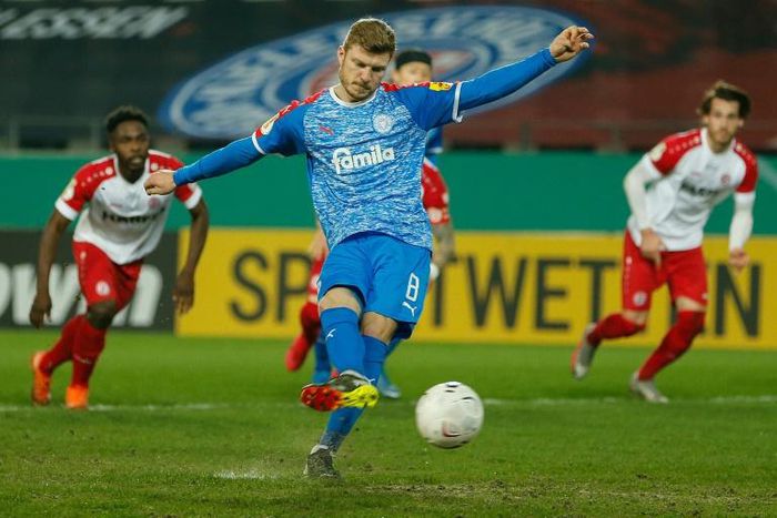 Holstein Kiel midfielder Alexander Muehling nets their first-half penalty at Kiel