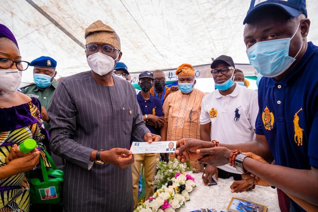 Lagos State Governor, Mr Babajide Sanwo-Olu displays his All Progressives Congress (APC) membership card after performing the registration and revalidation exercise at his ward in St. Stephen School Compound, Okepopo, Adeniji Adele, Lagos Island, on Tu...