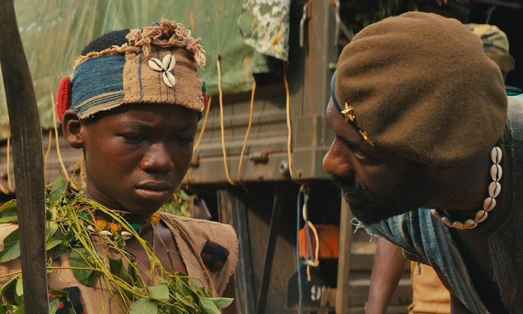 A scene from the movie [Abraham Attah and Idris Elba]