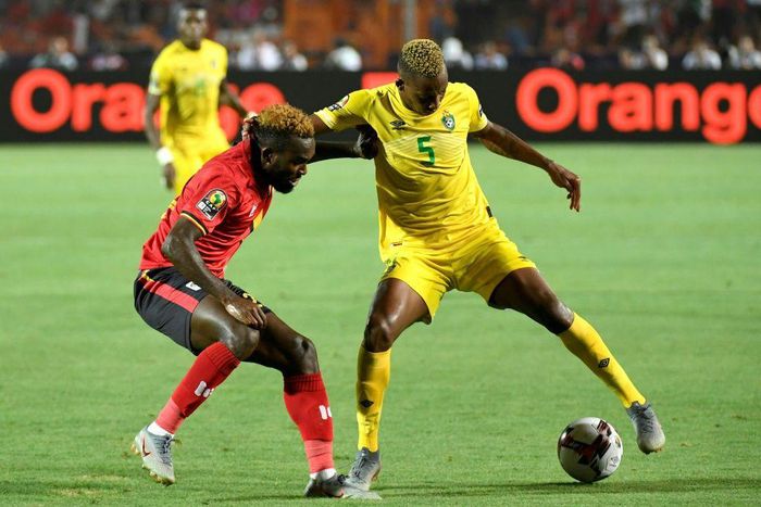 Golden Arrows defender Divine Lunga (R) playing for Zimbabwe against Uganda during the 2019 Africa Cup of Nations in Egypt.