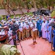 President Muhammadu Buhari with NYSC corps members [Presidency]